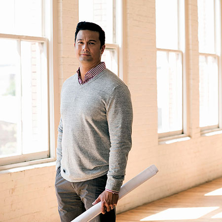 man-holding-blueprints